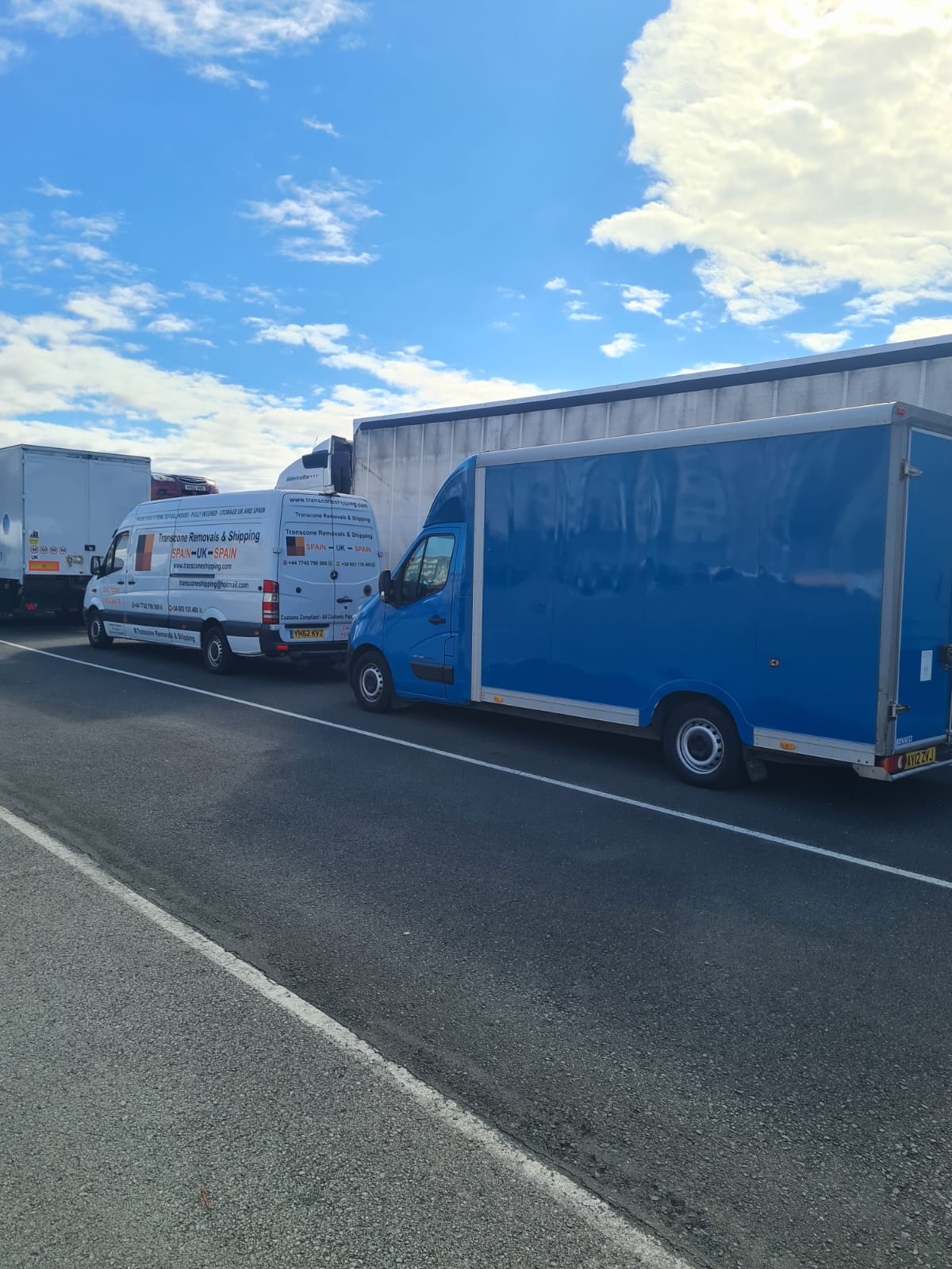 Transcone Removals fleet convoy with branded van and Luton truck en route between Spain and UK