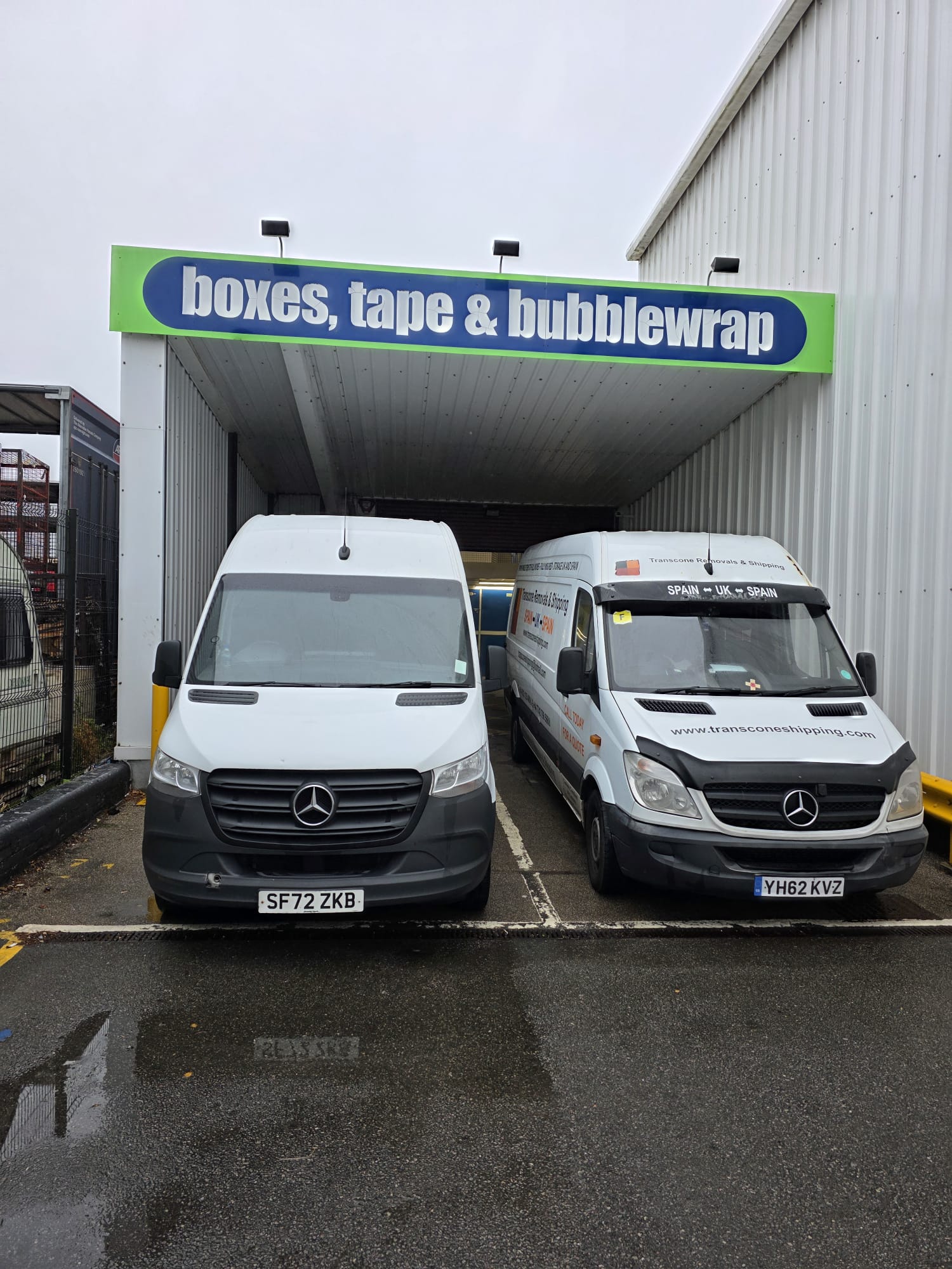 Transcone Removals branded Mercedes vans at packing supplies depot ready for UK to Spain routes