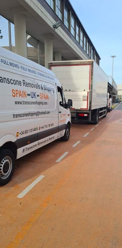 Transcone branded van and truck at loading dock preparing for UK to Spain removals