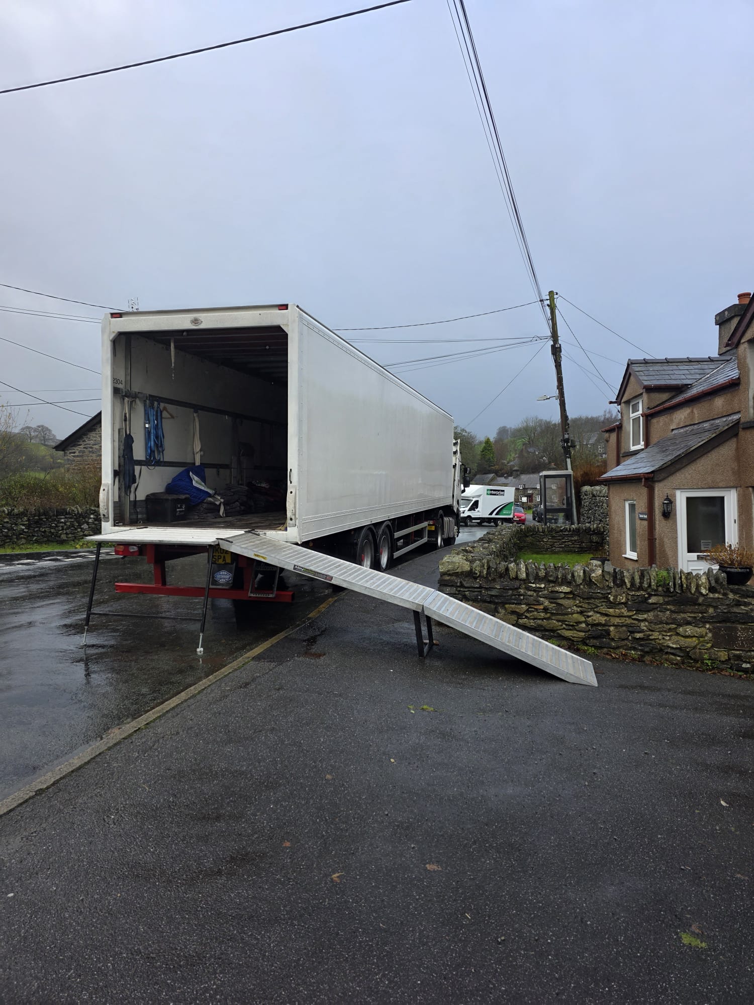 Transcone removal truck with loading ramp deployed for UK household collection